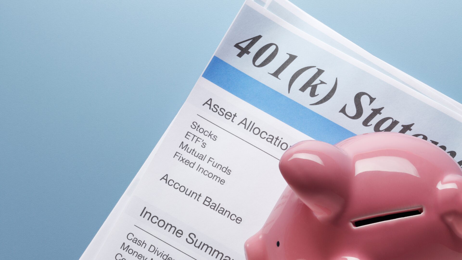 An image showing a person filling out a 401k form, which is the first step in how to start a 401k and monitor your investments and performance.