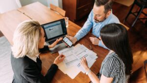 A small business owner discussing retirement savings with a financial advisor